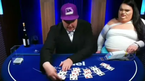 The Duel blackjack dealer working a shift in a baseball cap